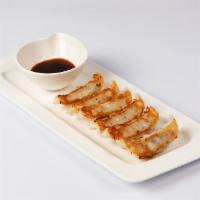 Gyoza (6 pieces) · Pan fried pork dumpling.