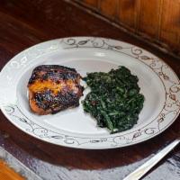Honey Glazed Salmon Steak · Glazed Salmon served with sauteed spinach.