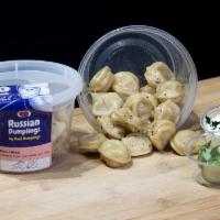 Cooked Pork Russian Dumplings, Organic Flour, 16oz · A 16oz container of our frozen Russian dumplings cooked in bay leaves, mixed with butter, an...