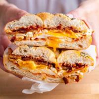 BACON EGG AND CHEESE ON A ROLL · 2 EGGS, CRISPY BACON AND MELTED CHEESE ON A ROLL