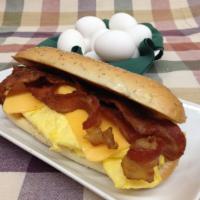 BACON EGG AND CHEESE ON A HERO · 4 COOKED EGGS, CRISPY BACON AND MELTED AMERICAN CHEESE ON A HERO
