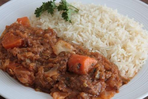 Legume · Mixed vegetable and smoked beef stew served with rice and side of black bean sauce & Pikliz
