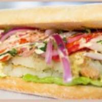 Double Yuca Patty Sandwich · Our famous yuca patties covered in criolla sauce, paired with lettuce, tomatoes. Choose betw...
