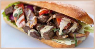 Lomo Saltado Sandwich · Steak and onions sautéed in a fiery wok and marinated in a soy and oyster sauce, lettuce, tomatoes and cilantro on top. 

The perfect Pachamama Secret Taste!