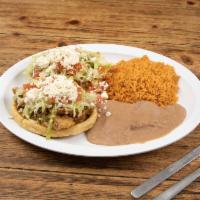 Sopes Plate · 2 thick fried corn tortilla topped with beans, your choice of meat, lettuce, tomato,  queso ...