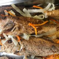 Escovitch Snapper · 1-2LBS SNAPPER with carrots onions bell pepers  and our famous Jamaican scotch bonnet pepper.