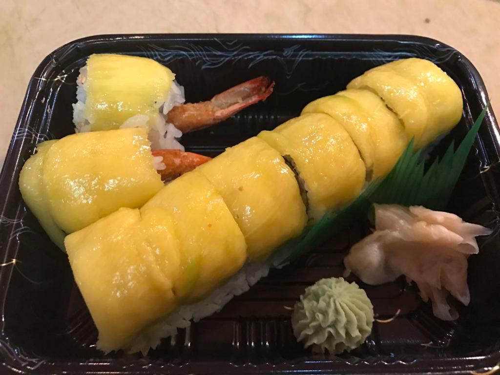 S9. Mango Special Roll · Tempura shrimp, avocado, and mango on top, with kabayaki mango sauce.