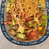 Mexican Fiesta Salad · Romaine lettuce mixed, tomato, onion, cheddar cheese, avocado, corn, marinated grilled chick...
