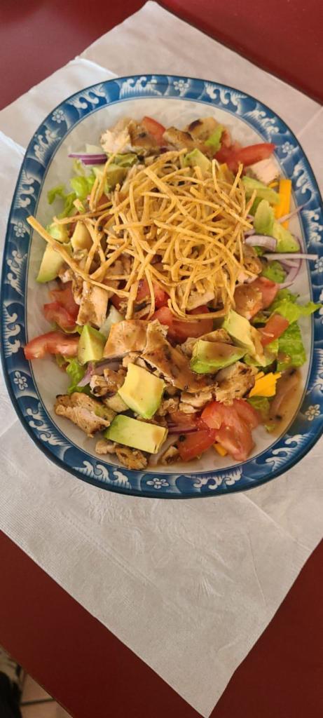 Mexican Fiesta Salad · Romaine lettuce mixed, tomato, onion, cheddar cheese, avocado, corn, marinated grilled chicken, corn tortilla chips with chipotle vinaigrette.