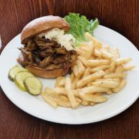 Ridgewood Burger deluxe · Cheddar, bacon and pulled pork. Deluxe burgers served with Cajun  french fries, lettuce, tom...