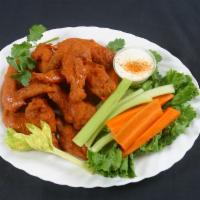 12 Chicken Wings · Fresh seasoned jumbo wings fried crispy served with celery, carrot, and buttermilk ranch.