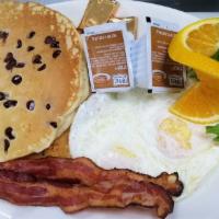 Pancake Breakfast · Short stack or tall stack pancakes 2 eggs, and choice of bacon , sausage , or ham steak.