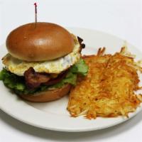 Breakfast Burger · TNT patty topped with fried egg, peppered bacon, cheddar cheese, lettuce, tomato, onion, may...