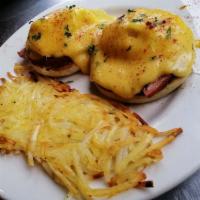 Eggs Benedict · Grilled ham on a fresh toasted English muffin, topped with poached eggs and a fresh cheese s...