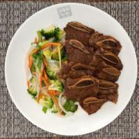 Beef Short Ribs  · Classic Korean BBQ beef short ribs marinated in our house sauce with stir fried vegetables o...