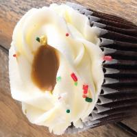 Chocolate Salted Caramel Cupcake · Chocolate Cupcake with vanilla buttercream frosting, homemade salted caramel, and sprinkles