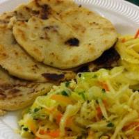 Pupusas de Queso ( Cheese Pupusas) · Pupusas thick griddle cake made of corn flour filled with cheese. Accompanied with cabbage s...