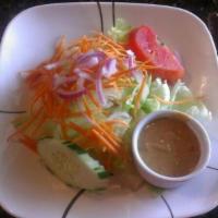 House Salad · Mixed green salad, cucumbers, tomatoes, carrots, red onions, fried Tofu served w/peanut sauce.