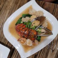 Seafood Delight · Lobster, shrimp, scallops, mussels, squid. Served with Chinese broccoli, shitake mushroom, c...