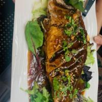 Whole Red Snapper · Bed of mixed salad w/jasmine rice.