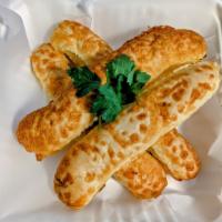 Super Cheesy Breadsticks · Can't have an American/Italian menu without these.... They're everyone's favorite. Fresh bre...