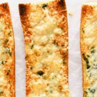 Fresh Baked Garlic/Parmesan Bread · Classic baguette, split in half and smothered in Garlic Butter and Italian Seasoning. Perfec...