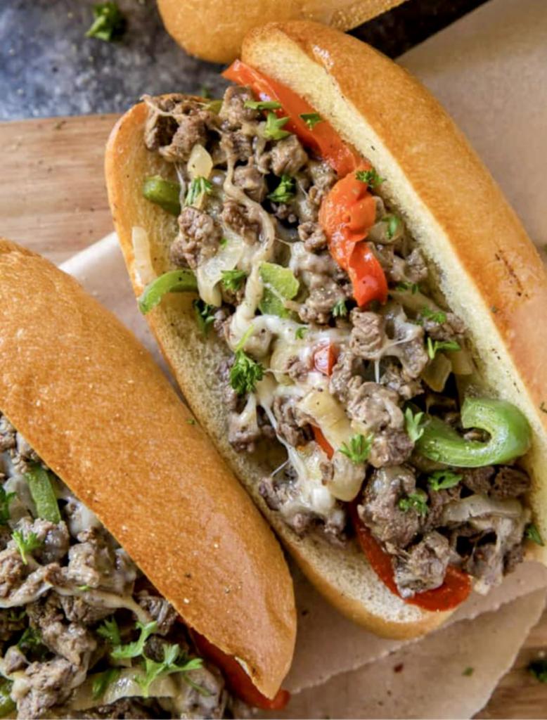 The Philly Cheese Steak Sub · It's from philly, so we have nothing funny to say about this sandwich... Thins sliced sirloin, flavored to perfection, then topped with sizzling peppers, onions, and garlic, oh, of course, provolone cheese.... Then we 