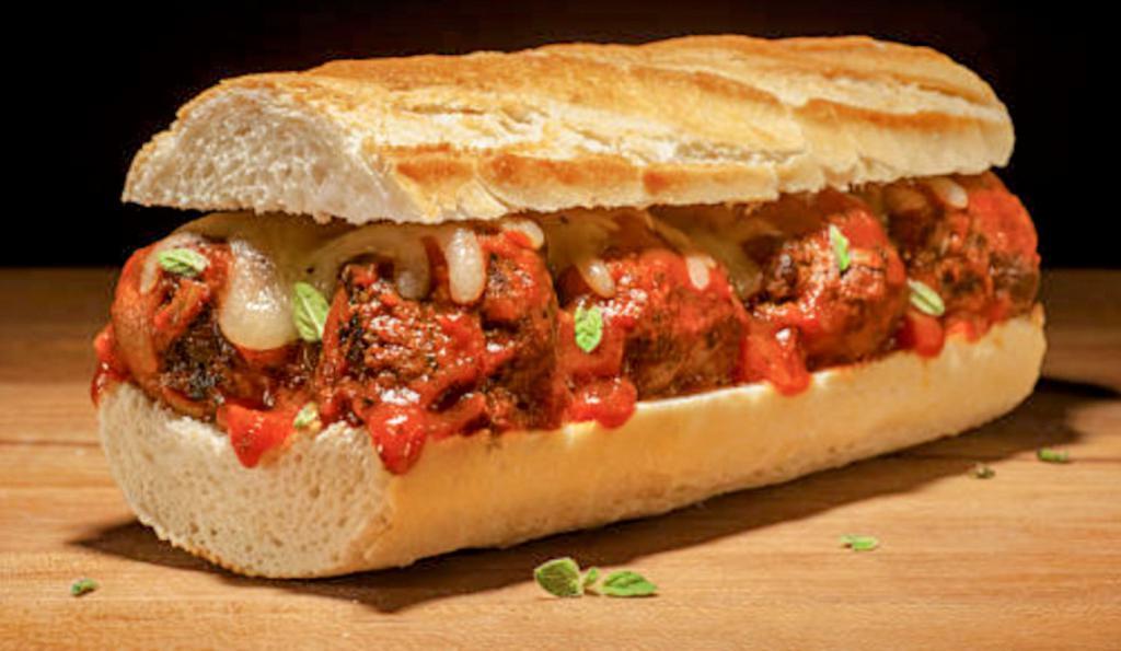 Meatball Sub · If you're a meatball sub lover, this is the one you'll come back for! Meatballs from edge to edge, covered with grilled peppers and onions, then smothered in our 