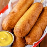 Fair Ground Corn Dogs · Crunchy yet moist, savory with a hint of sweet, these are the corn dogs you remember from be...