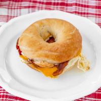Breakfast Bagel Sandwich · Choice of Toasted Bagel ＆ Spread with Fried Egg, Bacon or Sausage. New Option: Add Avocado.