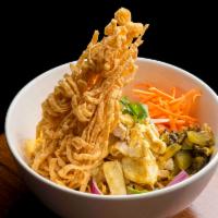Khao Soi chicken · Northern Thai style curry broth, egg noodles, egg noodles, chicken, pickled cabbage, red oni...