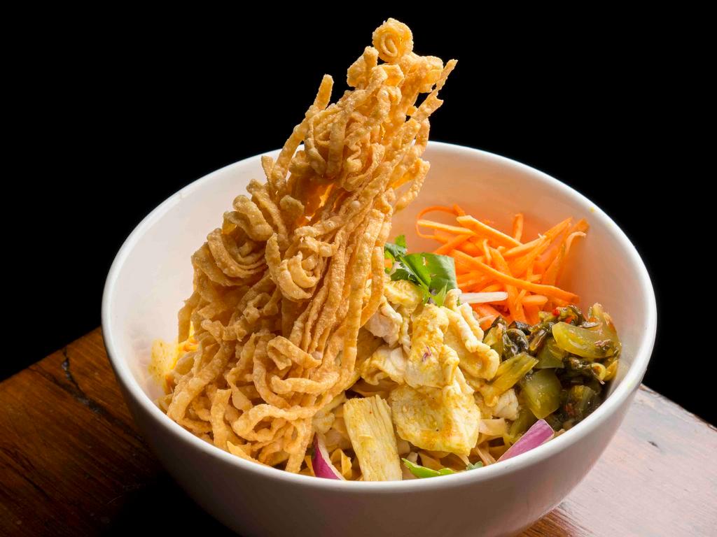 Khao Soi chicken · Northern Thai style curry broth, egg noodles, egg noodles, chicken, pickled cabbage, red onion and lime wedge.