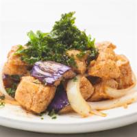 Eggplant Tofu with Spicy Garlic Sauce (V) · stir fried eggplant, tofu, onion, chilies, garlic, and Thai basil. (Vegan)