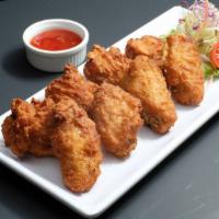 2. Chicken Wings · 6 pieces. Deep-fried chicken wings marinated in a mixture of garlic pepper and Thai spices s...