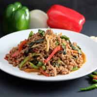 26. Pad Sweet Basil · Traditional Thai stirred fried minced chicken or minced pork with garlic, chili, green beans...