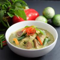 38. Green Curry · Gluten-free. Green curry sauce with coconut milk, Thai eggplant, green beans, bell pepper, a...