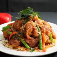 42. Crispy Basil Chicken · Spicy. Stir fried crispy chicken with green bean, onion, bell pepper and crispy sweet Thai b...