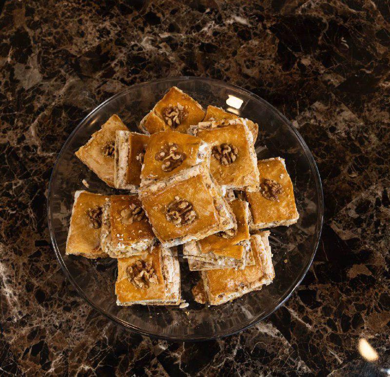 Uzbek Pakhlava (1 piece) · Dough layers with walnuts.