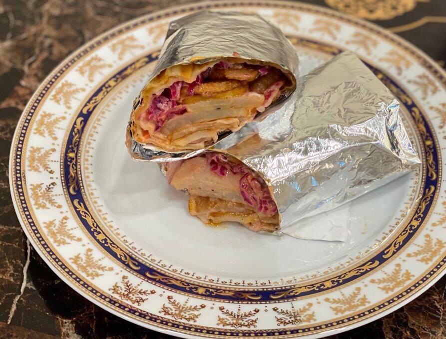 Vegetarian Sandwich · Fried home-style potatoes in uzbek bread or lavash topped with red cabbage, tomato, red onion and suzma.