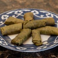 Dolma Platter (5 pieces) · Grape leaves stuffed with rice, ground beef herbs and spices.