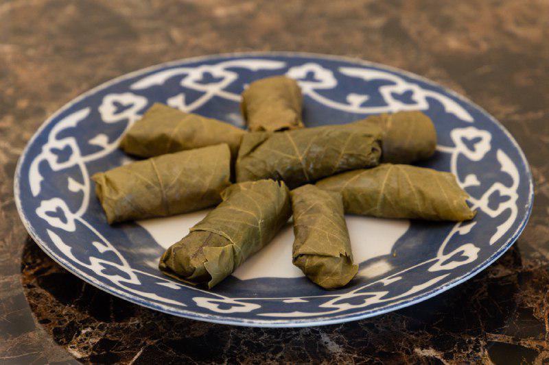 Dolma Platter (5 pieces) · Grape leaves stuffed with rice, ground beef herbs and spices.