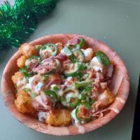 Loaded Tots · Crispy tater tots with our house-made beer cheese, bacon, jalapenos, sour cream, and scallio...