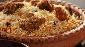 Goat biryani dinner · Goat biryani, tandoori naan, and mix raita.