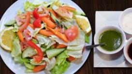 House Salad · Fresh cucumbers, carrots, onions, lettuce, and tomatoes. Served with house dressing.