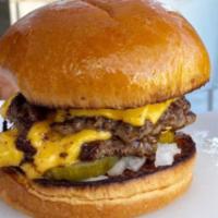 Classic Smash Double Cheeseburger · 1/4 lb Wagyu, double cheeseburger made with American cheese with chopped onions, pickles, mu...