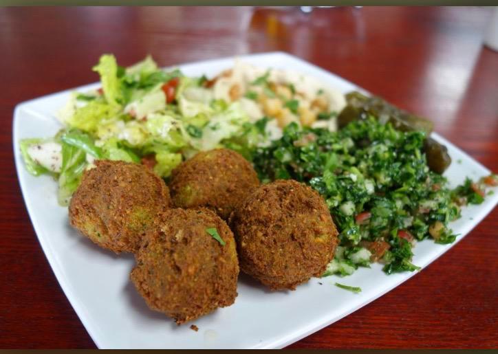 Falafel plate · A combination platter of falafel, hummus, baba ghanoush, tabouleh, and more. Plate.