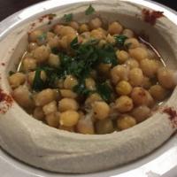 Hummus  · Plate comes with only 1 pita. Additional pita may be requested for an additional charge.