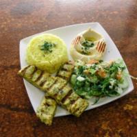 Lula Chicken Kabob · Ground chicken seasoned with our special blend of spices served with side salad, hummus, pit...