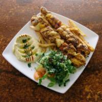 Shish Taouk · Cubed chicken marinated in our blend of spices Then skewered and grilled to perfection, serv...