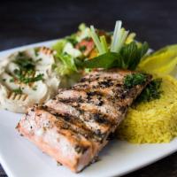Salmon · Grilled filet served with side salad, hummus, pita bread, and your choice of rice or fries.